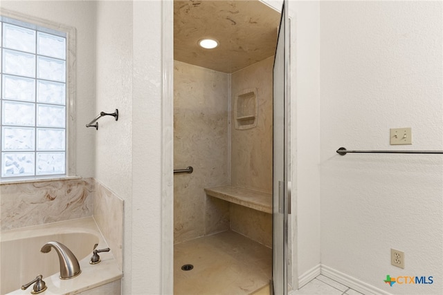 bathroom with shower with separate bathtub