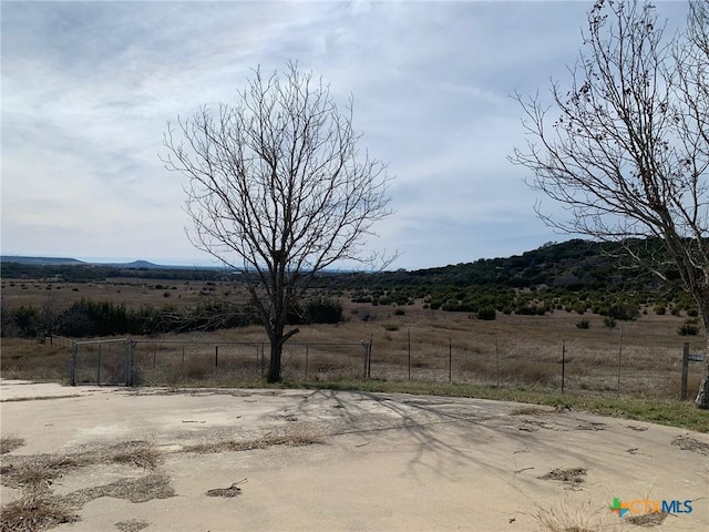 view of yard with a rural view