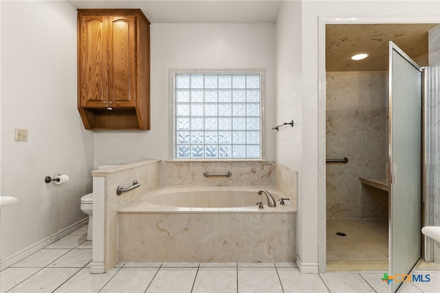 bathroom featuring tile patterned flooring, shower with separate bathtub, and toilet