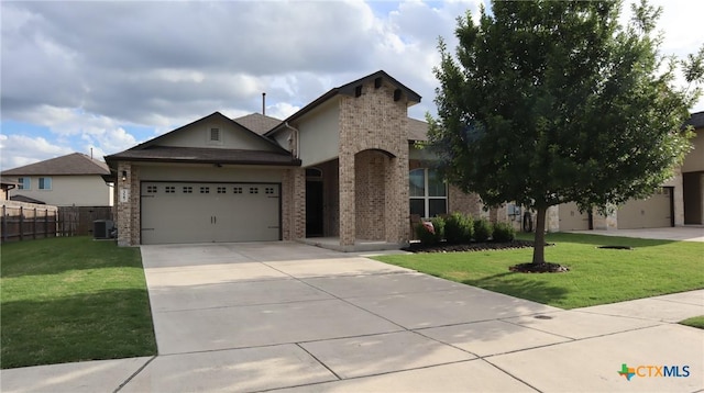 327 Limestone Crk, New Braunfels, TX 78130 - view of front of house with concrete driveway, a garage, brick siding, and stucco siding