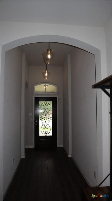 327 Limestone Crk, New Braunfels, TX 78130 - doorway with arched walkways and dark wood finished floors