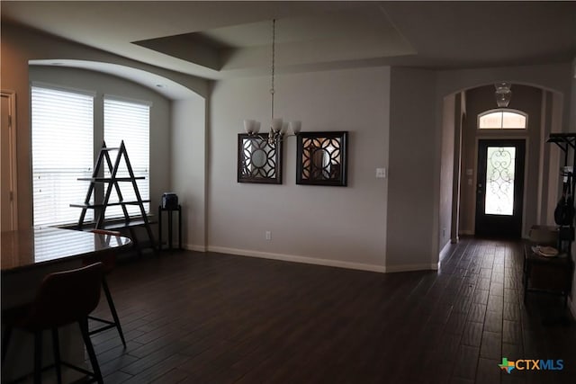 327 Limestone Crk, New Braunfels, TX 78130 - entryway featuring arched walkways, dark wood-style flooring, and a raised ceiling