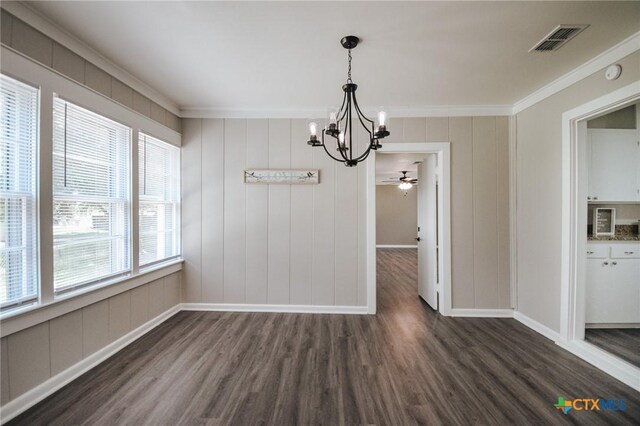 unfurnished dining area featuring visible vents, ornamental molding, a ceiling fan, baseboards, and dark wood-style flooring