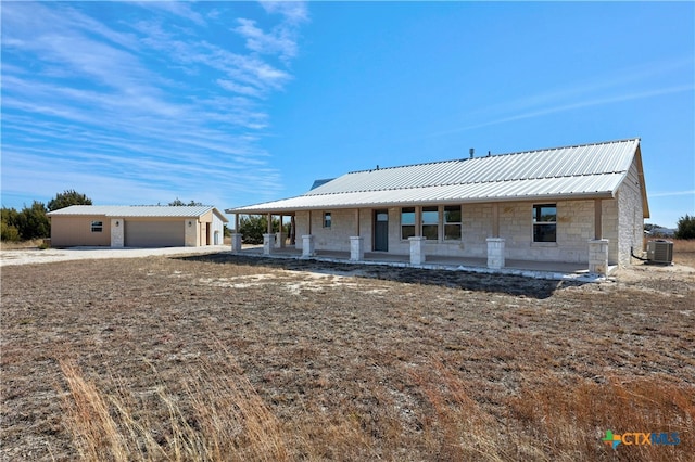 view of front of home featuring covered porch and central air condition unit