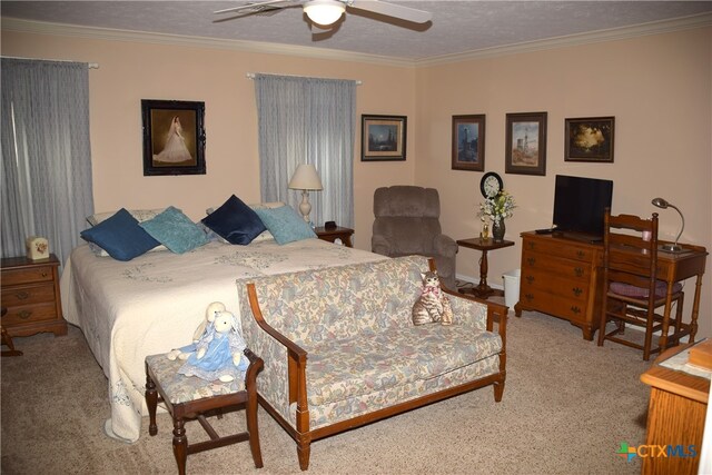 bedroom featuring a textured ceiling, light carpet, ceiling fan, and crown molding