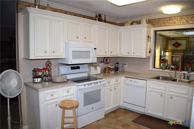 kitchen with crown molding, a textured ceiling, sink, white cabinets, and white appliances