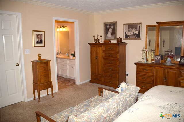 bedroom with connected bathroom, a textured ceiling, light carpet, and ornamental molding