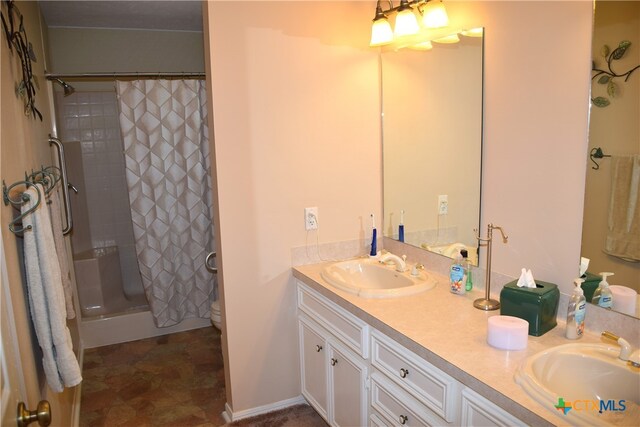 bathroom featuring walk in shower, vanity, and toilet