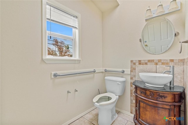 bathroom with tile patterned floors, vanity, and toilet