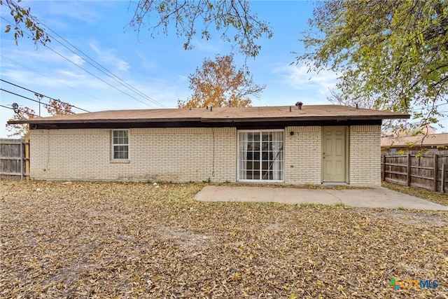 back of house with a patio