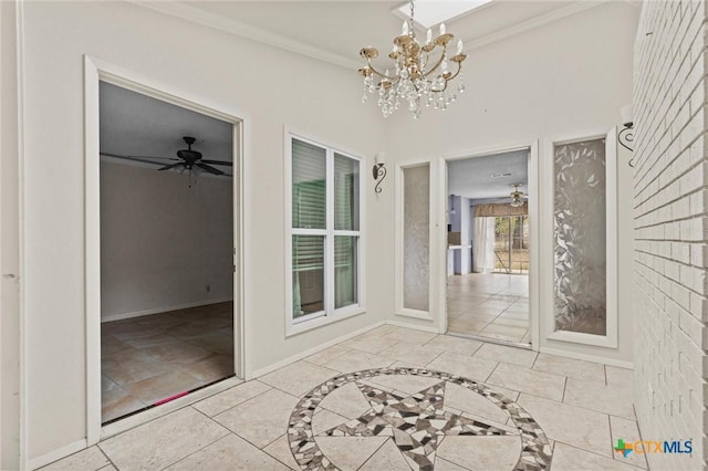 unfurnished sunroom featuring ceiling fan with notable chandelier