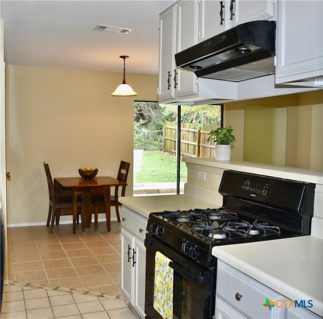 2007 Castle Gate Cir, San Marcos, TX 78666 - kitchen featuring black gas stove, extractor fan, light tile patterned floors, white cabinetry, and light countertops