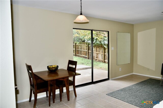2007 Castle Gate Cir, San Marcos, TX 78666 - dining area featuring light tile patterned flooring and baseboards
