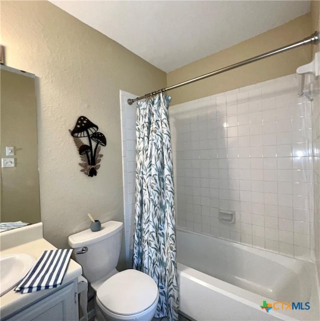 2007 Castle Gate Cir, San Marcos, TX 78666 - bathroom featuring a textured wall, shower / bath combo with shower curtain, and vanity