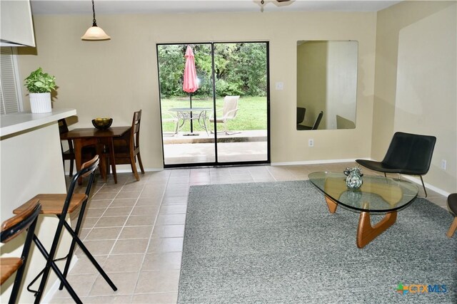 2007 Castle Gate Cir, San Marcos, TX 78666 - living room featuring light tile patterned floors and baseboards