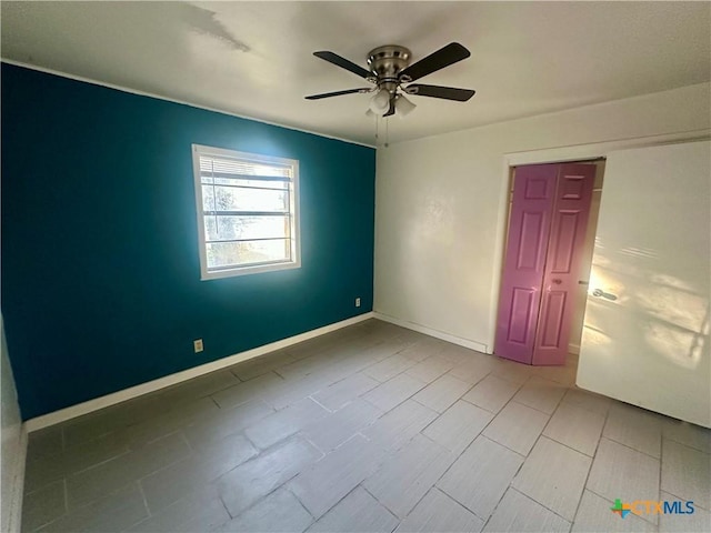 empty room featuring ceiling fan