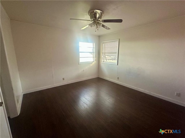 unfurnished room with ceiling fan and dark hardwood / wood-style floors