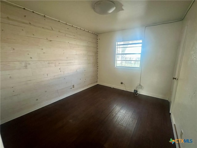 empty room featuring dark hardwood / wood-style floors