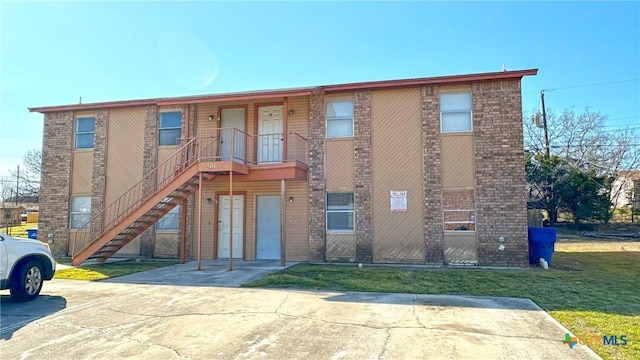 view of property featuring stairs