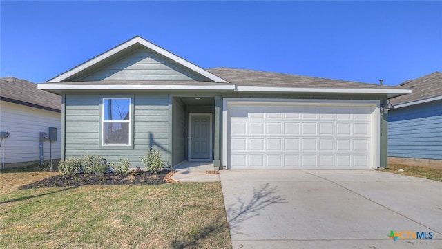 ranch-style house featuring a garage and a front lawn