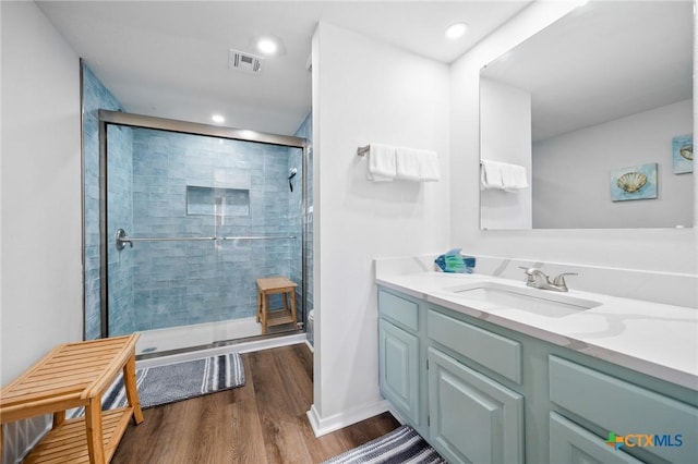 5973 State Highway 361 Unit 125, Port Aransas, TX 78373 - full bath with vanity, a shower stall, wood finished floors, and recessed lighting