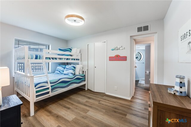 bedroom with hardwood / wood-style flooring