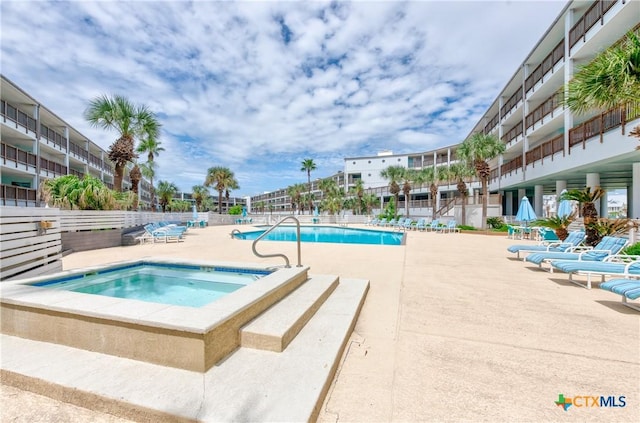 5973 State Highway 361 Unit 125, Port Aransas, TX 78373 - community pool with a community hot tub and a patio