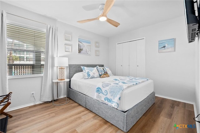 5973 State Highway 361 Unit 125, Port Aransas, TX 78373 - bedroom featuring wood finished floors, ceiling fan, and a closet