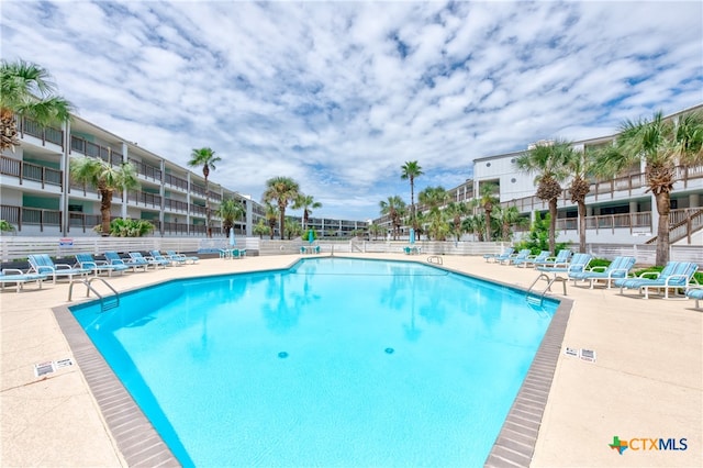 view of swimming pool featuring a patio area