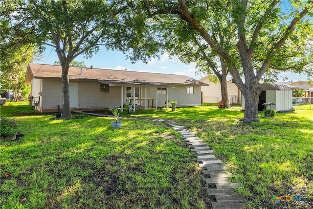 211 Balboa Dr, Universal City, TX 78148 - rear view of house featuring a yard