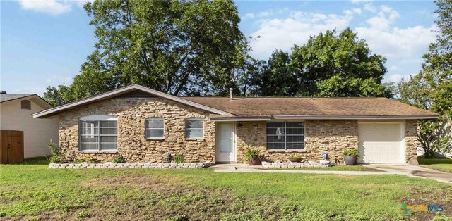 211 Balboa Dr, Universal City, TX 78148 - single story home with an attached garage, stone siding, a front yard, and driveway