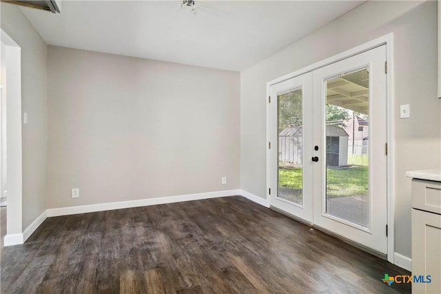 211 Balboa Dr, Universal City, TX 78148 - spare room with french doors and dark wood-style flooring