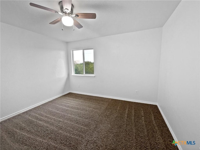 spare room with ceiling fan and carpet floors