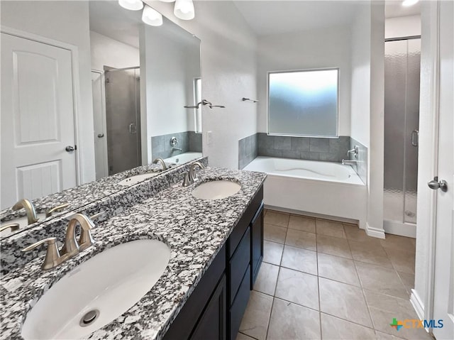 bathroom with separate shower and tub, tile patterned floors, and vanity