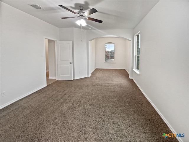 carpeted spare room featuring ceiling fan