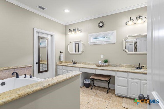 3 Sago Dr, Port Lavaca, TX 77979 - full bathroom featuring crown molding, double vanity, tile patterned flooring, a garden tub, and recessed lighting