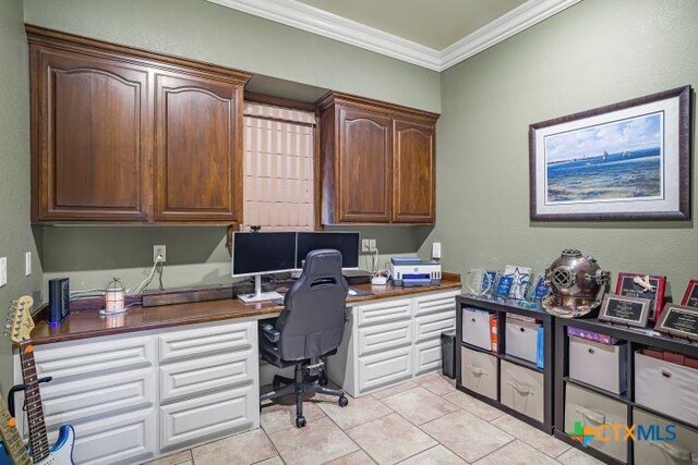 3 Sago Dr, Port Lavaca, TX 77979 - home office with built in study area, crown molding, and light tile patterned floors
