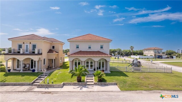 3 Sago Dr, Port Lavaca, TX 77979 - mediterranean / spanish home featuring covered porch, a balcony, a tile roof, and stucco siding