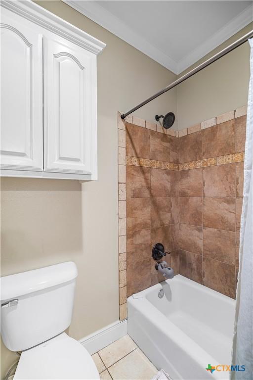 3 Sago Dr, Port Lavaca, TX 77979 - bathroom with shower / tub combo, toilet, tile patterned flooring, and baseboards