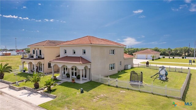 3 Sago Dr, Port Lavaca, TX 77979 - rear view of property with stucco siding, a garage, and a tile roof