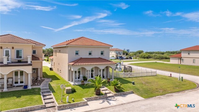 3 Sago Dr, Port Lavaca, TX 77979 - back of house featuring french doors, a porch, stucco siding, a tile roof, and a residential view