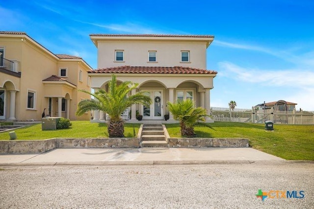 3 Sago Dr, Port Lavaca, TX 77979 - mediterranean / spanish-style house with stucco siding, a tiled roof, and covered porch