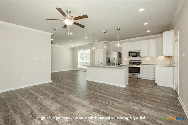 7100 Mcgregor Loop, Killeen, TX 76549 - kitchen featuring appliances with stainless steel finishes, ornamental molding, open floor plan, recessed lighting, and ceiling fan