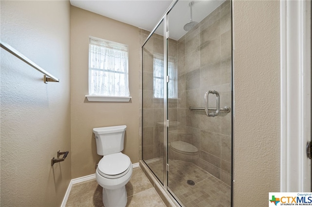 bathroom with toilet, an enclosed shower, and tile patterned floors