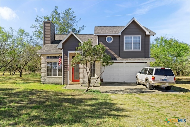 view of front of home with a garage and a front yard