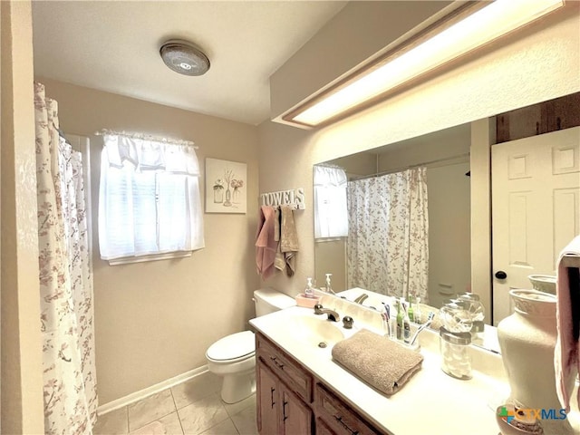 bathroom featuring tile patterned flooring, curtained shower, baseboards, toilet, and vanity