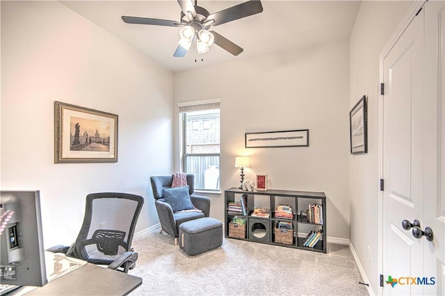 carpeted home office with ceiling fan