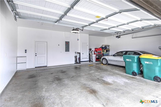 garage featuring a garage door opener and electric panel