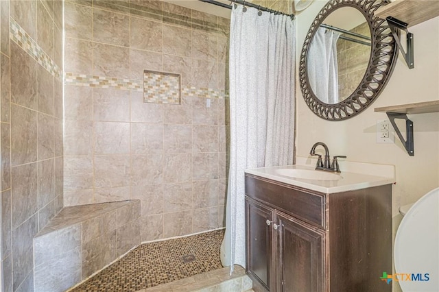 123 Burnet St, Port Lavaca, TX 77979 - full bath featuring tiled shower, vanity, and toilet