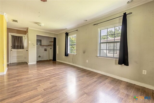 123 Burnet St, Port Lavaca, TX 77979 - unfurnished bedroom with crown molding, wood finished floors, and baseboards